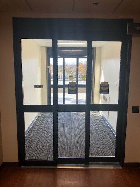 Automatic sliding door leading to hospital courtyard