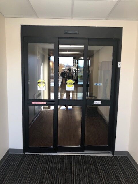 Automatic sliding door leading to hospital courtyard