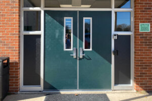 New exterior school doors, hunter green with windows