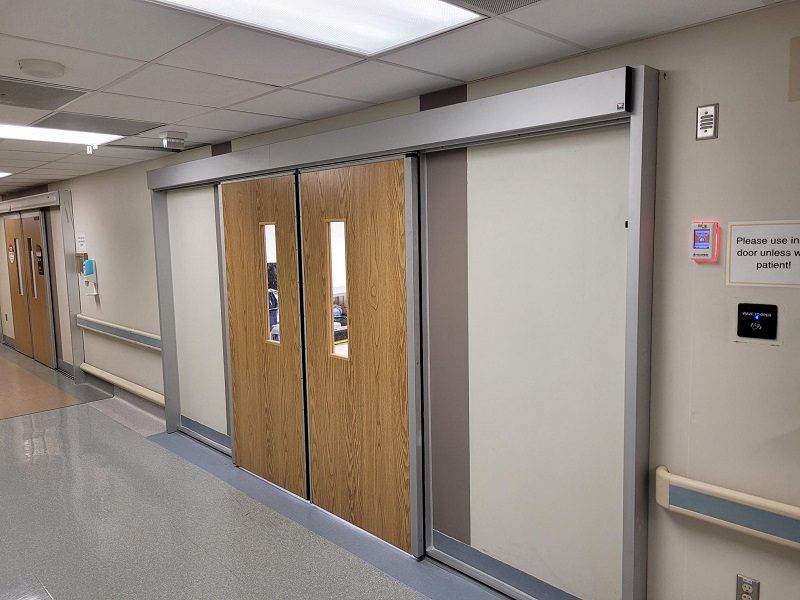 Sliding wood doors for an operating room