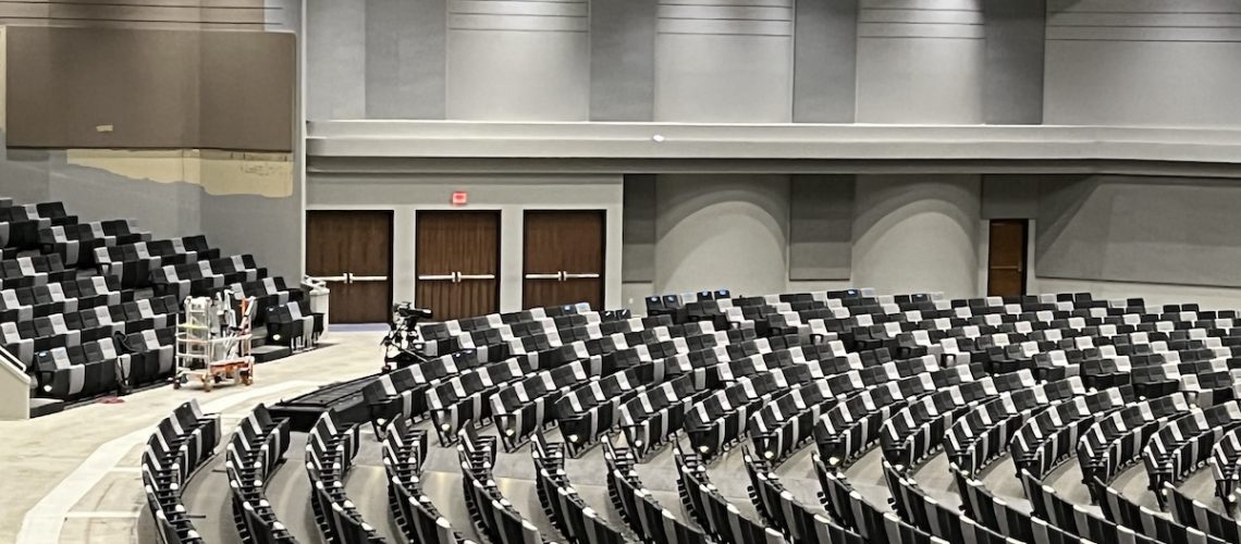 James River Church auditorium with padded seats and brand new wood doors