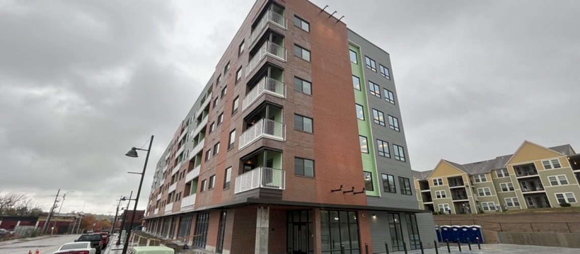One Nine Vine apartments, view of building and external doors on an overcast day