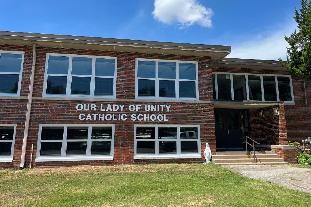 Our Lady of Unity School front of building with sign