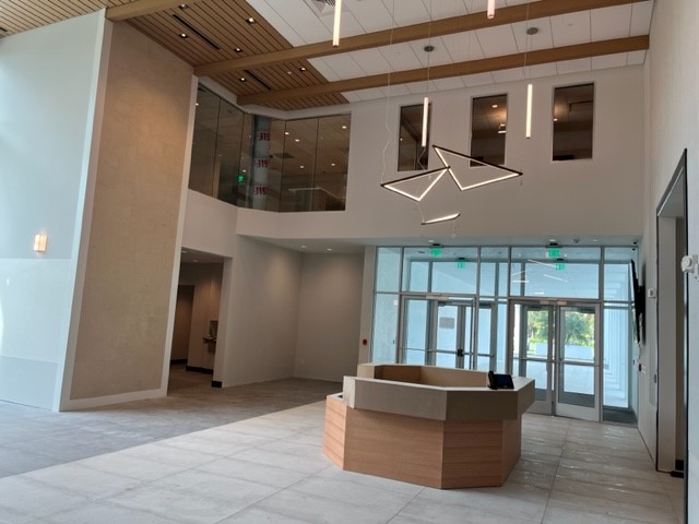 Internal shot of cultural center foyer with commercial door openings
