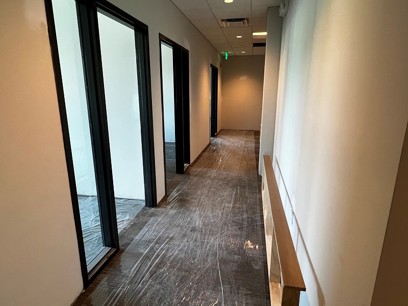 Hallway under construction with commercial door frames