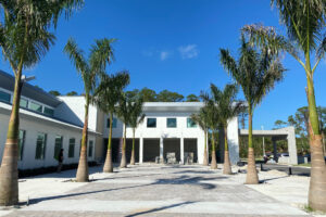 External shot of Nina Iser Jewish Cultural Center with palm trees and commercial door openings