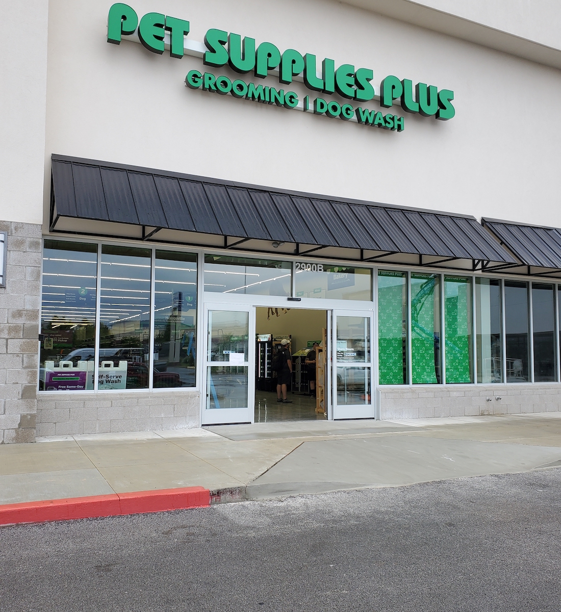 Outdoor shot of new automatic sliding doors at Pet Supplies Plus
