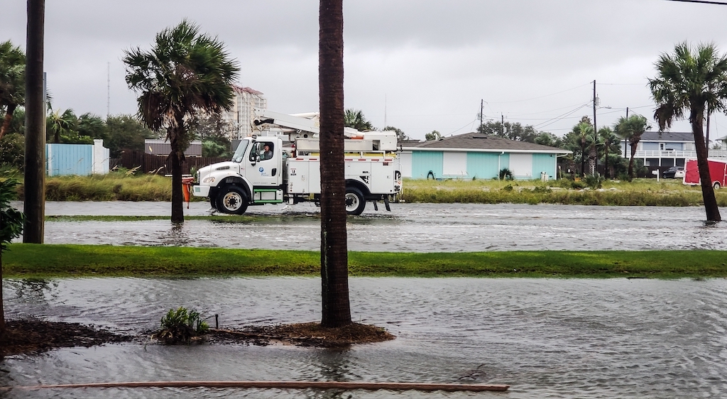 Emergency vehicle on a flooded street after a hurricane